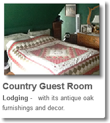 ﷯Country Guest Room Lodging - with its antique oak furnishings and decor.