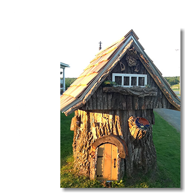 Wondering What This Is? ﷯We had an old tree stump that we decided to make into at 'Troll House", complete with front door, roof and other decor.