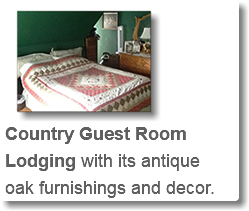 ﷯Country Guest Room Lodging with its antique oak furnishings and decor.